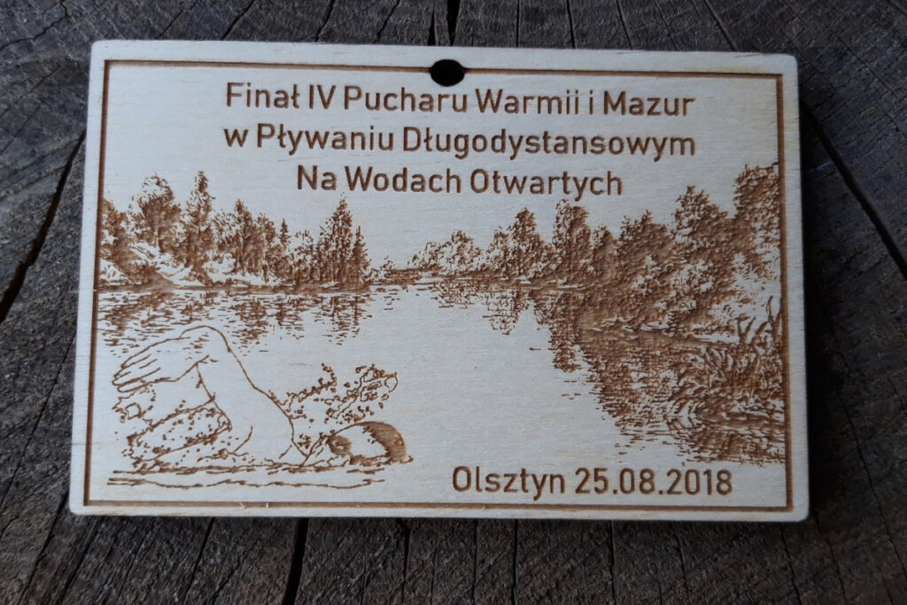Finał IV Pucharu Warmii i Mazur w Pływaniu Długodystansowym Na Wodach Otwartych – drewniany medal Finał IV Pucharu Warmii i Mazur w Pływaniu Długodystansowym Na Wodach Otwartych – drewniany medal