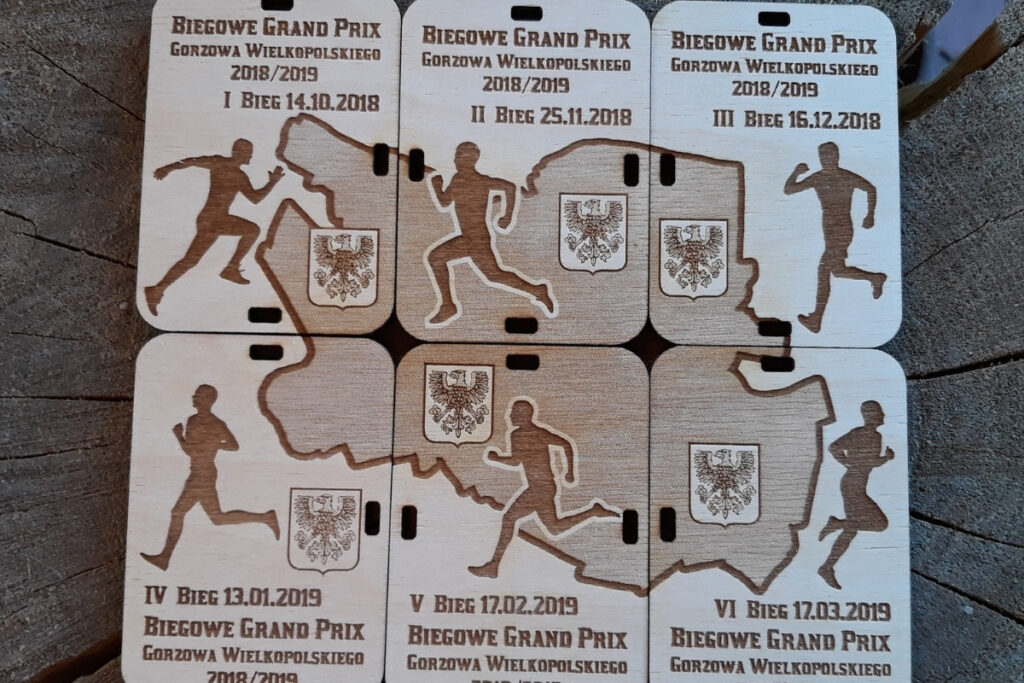 Zestaw 6 drewnianych medali tworzących kompletną tabliczkę na Biegowe Grand Prix Gorzowa Wielkopolskiego.